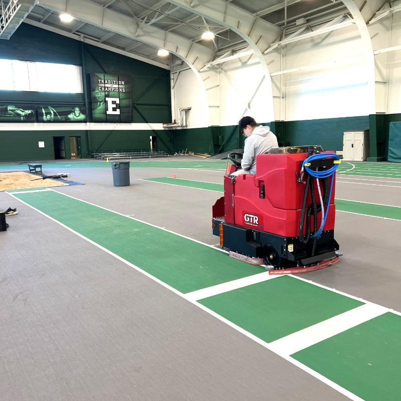 FactoryCat Ride On Floor Scrubbers GTR field house sports floors - https://assets.factorycat.com/demoImages/2025/april/GTR-Ride On Floor Scrubbers-field house-sports floors-Columbus-USA-315.jpg - 800 - 800 - 315 A FactoryCat GTR battery powered rider floor scrubber cleans the sports floor in a field house in Columbus OH.