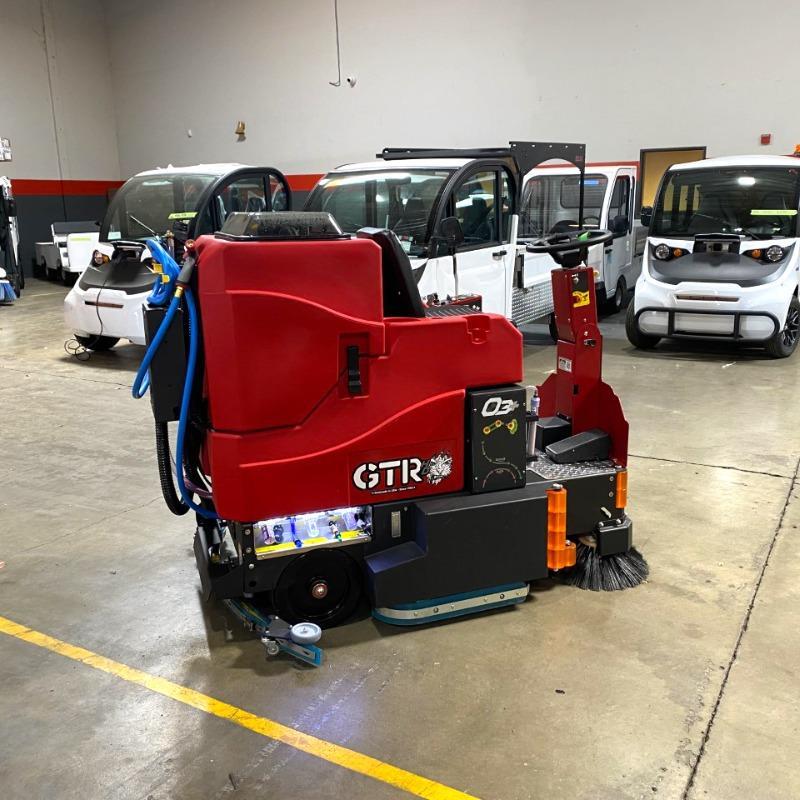 FactoryCat Ride On Floor Scrubbers GTR garage concrete - https://assets.factorycat.com/demoImages/2025/april/GTR-Ride On Floor Scrubbers-garage-concrete-Miami-USA-658.jpg - 800 - 800 - 658 GTR Ride On Floor Scrubber cleaning the concrete floor in a maintenance garage a a university in Miami, Florida