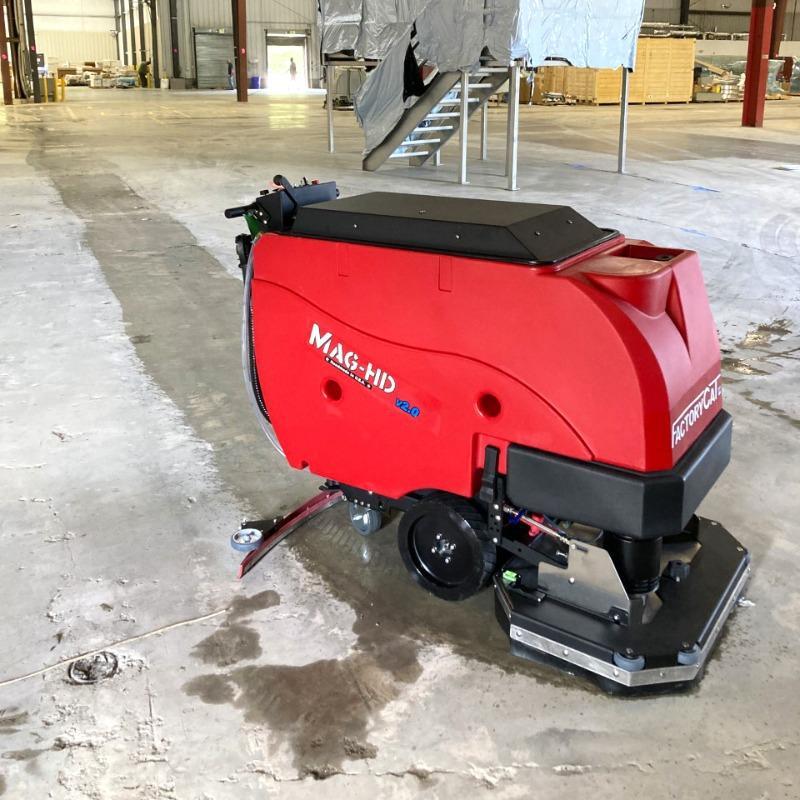 FactoryCat Walk Behind Floor Scrubbers Mag-HD warehouse concrete - https://assets.factorycat.com/demoImages/2025/april/Mag-HD-Walk Behind Floor Scrubbers-warehouse-concrete-Knoxville-USA-323.jpg - 800 - 800 - 323 A FactoryCat Mag-HD walk behind floor scrubber cleans the concrete floors in a warehouse outside Knoxville, Tennessee.