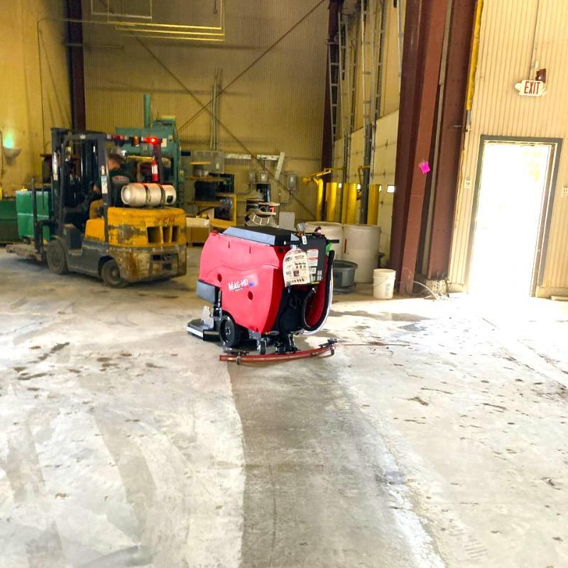 FactoryCat Walk Behind Floor Scrubbers Mag-HD warehouse concrete - https://assets.factorycat.com/demoImages/2025/april/Mag-HD-Walk Behind Floor Scrubbers-warehouse-concrete-Knoxville-USA-327.jpg - 800 - 800 - 327 A FactoryCat Mag-HD walk behind floor scrubber cleans the concrete floors in a warehouse outside Knoxville, Tennessee.