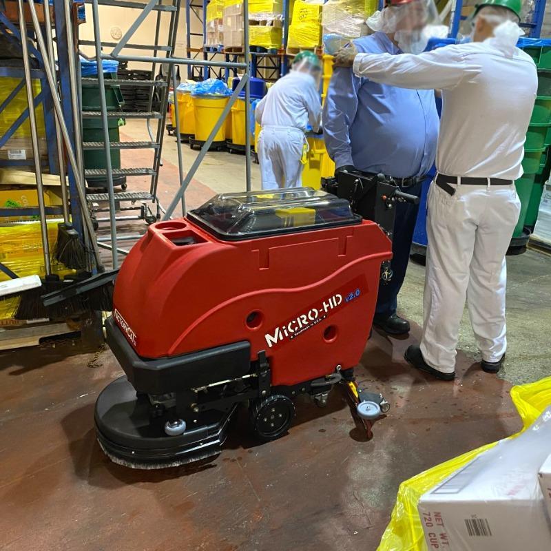 FactoryCat Walk Behind Floor Scrubbers Micro-HD production floor epoxy - https://assets.factorycat.com/demoImages/2025/april/Micro-HD-Walk Behind Floor Scrubbers-production floor-epoxy-Baltimore-USA-345.jpg - 800 - 800 - 345 A FactoryCat Micro-HD battery floor scrubber cleaning the epoxy production floor of a bakery in Baltimore, Maryland.