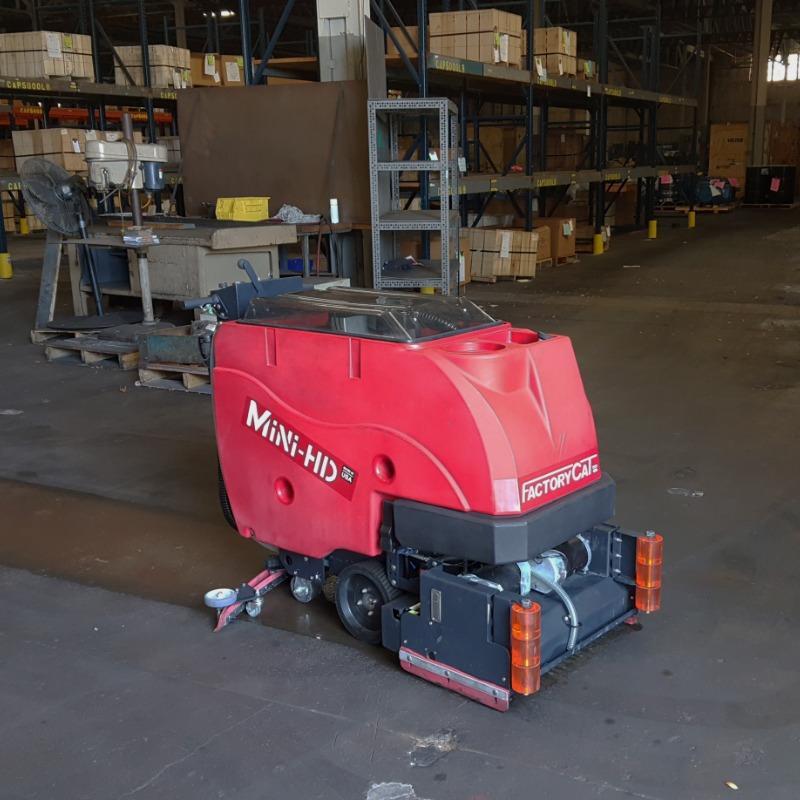 FactoryCat Walk Behind Floor Scrubbers Mini-HD warehouse concrete - https://assets.factorycat.com/demoImages/2025/april/Mini-HD-Walk Behind Floor Scrubbers-warehouse-concrete-Pittsburg-USA-550.jpg - 800 - 800 - 550 FactoryCat Mini-HD Walk Behind Floor Scrubbers cleans the concrete warehouse floor at a foundry in Pennsylvania